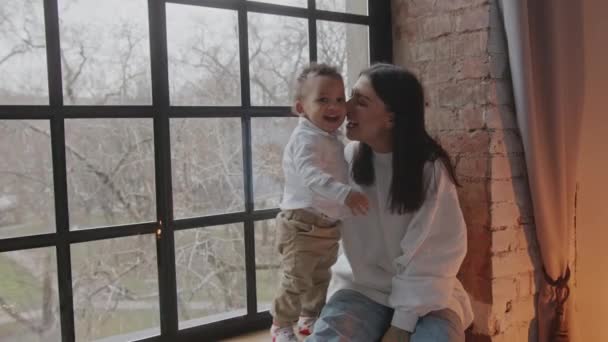 Caring Young Mother Playing Her Little Son Window Sill Medium — Video Stock