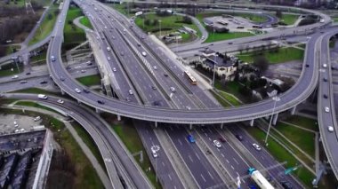 Aerial drone top view of multilevel highway with bridges and ramps, and cars going. High quality 4k footage