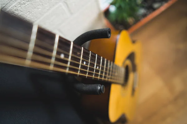 acoustic guitar leaning on the wall, music concept. High quality photo