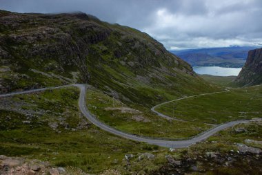 Scenic view of winding single track road Bealach na Ba through the mountains in Scottish Highlands