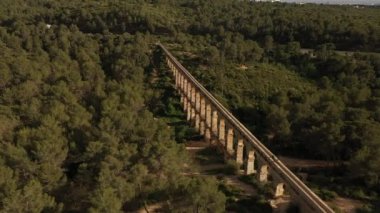 Roman Aqueduct Pont del Diable on sunny day in Tarragona, Spain