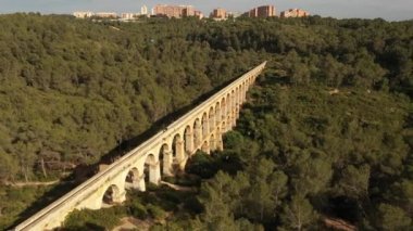Roman Aqueduct Pont del Diable on sunny day in Tarragona, Spain