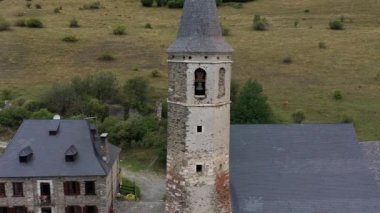Aerial view of the Montgarri high mountain refuge in summer, with the Pyrenees mountains of the Aran Valley in the background, Lleida, Spain