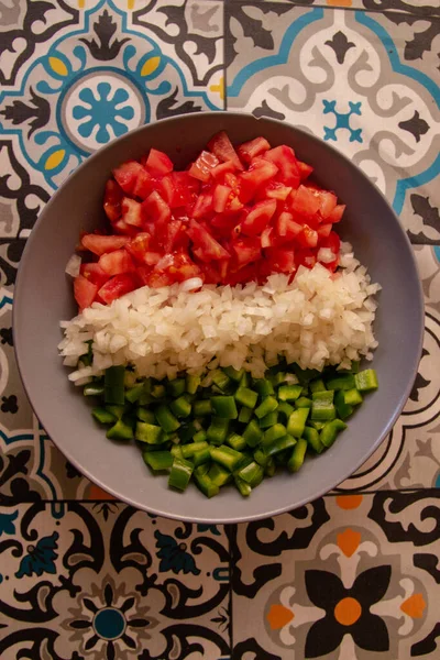 Tomato, green pepper and onion cut into dice in a bowl, Isolated on background