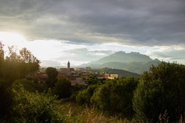 View of a Esparreguera town at sunset, with montserrat in the background.