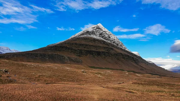 The Bulandstindur, or Pyramid mountain with snow on the summit, in the East Fjord region of Iceland