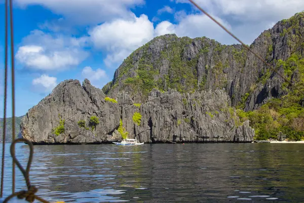 Views from the boat of the rocks that surround the secret lagoon in Miniloc island, Philippines.