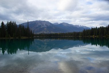 Lake Annette with trees and reflection. Jasper National Park, Alberta, Canada. Banff National Park. clipart