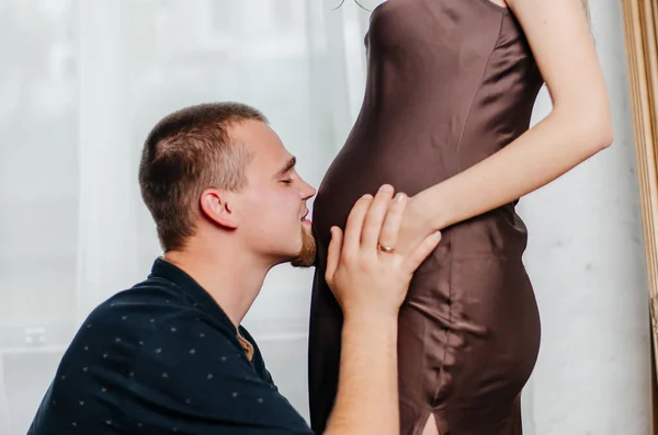 Man Caresses Stomach Pregnant Girl — стоковое фото