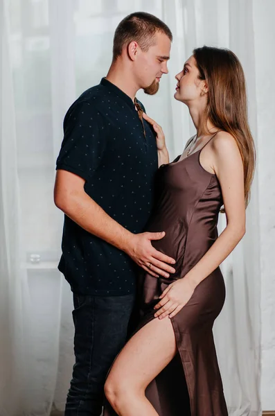 Young Man Hugs Pregnant Woman — Photo