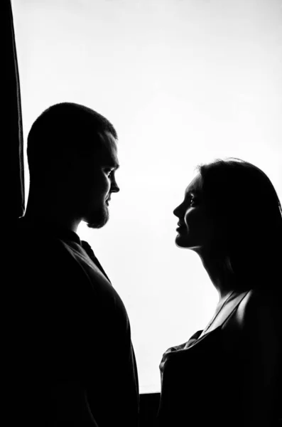 stock image Couple looking at each other with white background. Black and white photo