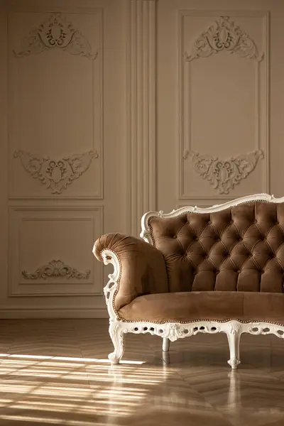 stock image a brown couch with a white trim  