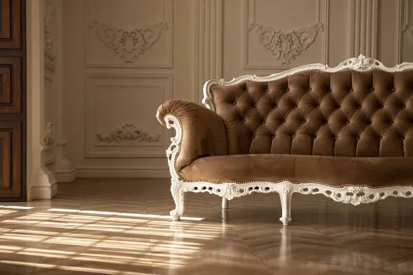 stock image a brown couch with a white trim  