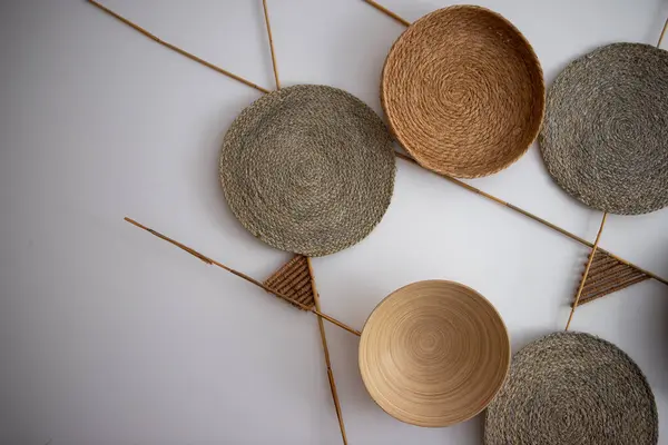 stock image a collection of woven baskets on a white surface