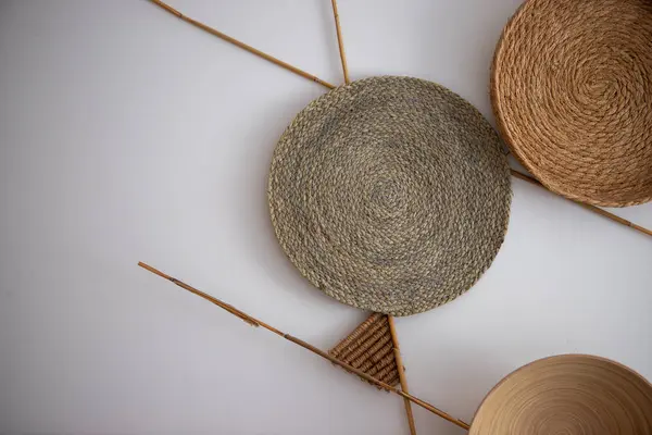 stock image a collection of woven baskets on a white surface