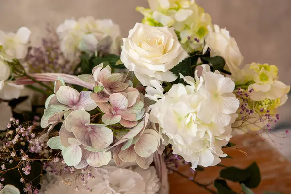 stock image a bouquet of different flowers on the table