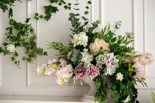 stock image flowers in a vase in a bright room with a bed