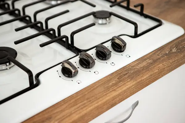 stock image kitchen stove with burners and regulating valve