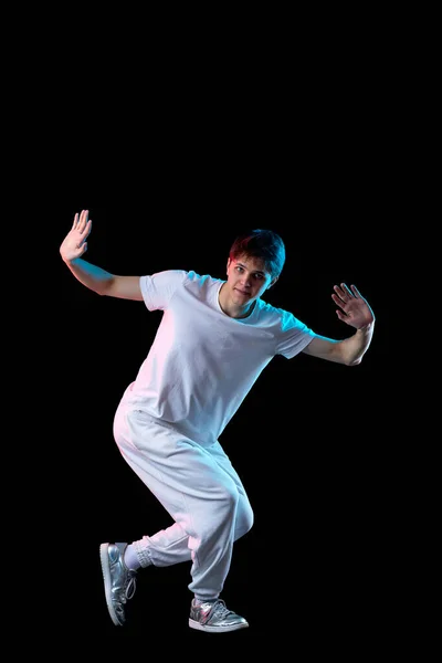 Delighted Young Man White Shirt Dancing Neon Light Black Background Stock Picture
