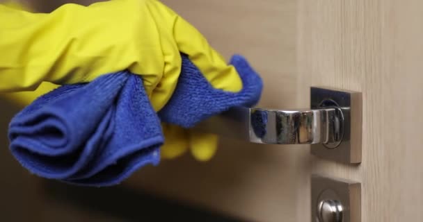 Female Hands Yellow Rubber Gloves Cleaning Doorhandle Using Blue Rag — Stock Video