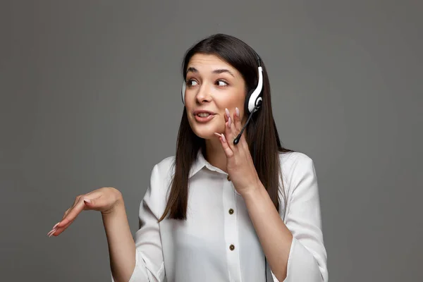 happy woman with headset is consulting clients online. Call center