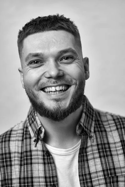 Smiling Young Man Stylish Hair Beard Plaid Shirt Gray Background — Stockfoto
