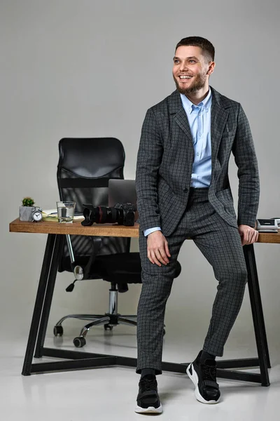 Professional Male Photographer Smiling Cheerfully While Working Her Desk — Foto Stock
