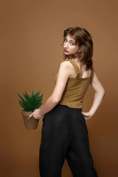 Young Woman Stylish Hairstyle Posing Plant Pot Beige Background — Photo