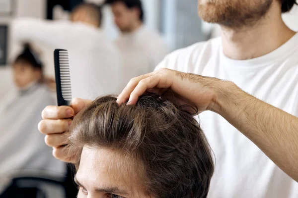 Close Professional Male Hairstylist Combing Young Customers Hair Barbershop — Photo