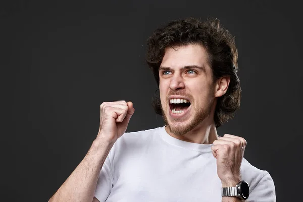 Very Excited Young Bearded Man Showing Victory Gesture Holding Fists — Foto Stock