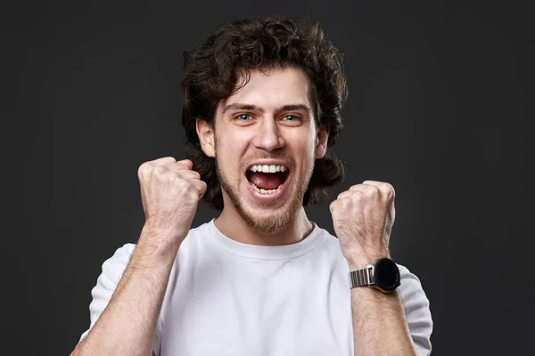 Very Excited Young Bearded Man Showing Victory Gesture Holding Fists — Foto Stock