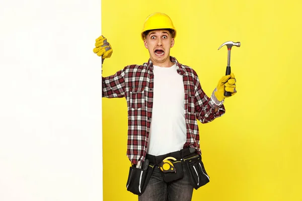 Scared Professional Builder Work Clothes Helmet Holding Hammer Copy Space — Stock Photo, Image
