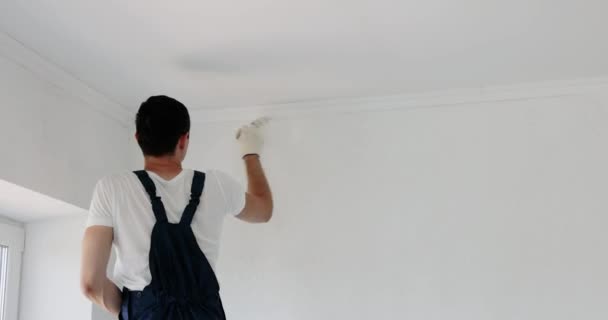Repairman Man Uniform Painting Wall White Color Brushes While Renovating — Stock Video