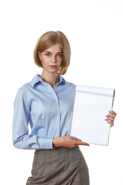 portrait of blonde business lady in formal wear showing empty clipboard on white background