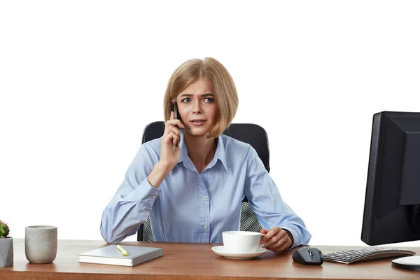 Upset Surprised Blonde Business Woman Working Computer Having Phone Conversation Royalty Free Stock Photos