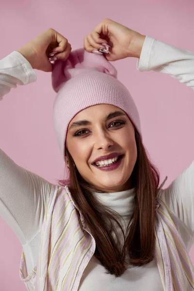 Portrait Happy Playful Woman Keeps Hands Pink Hat Pastel Pink — Stock Photo, Image
