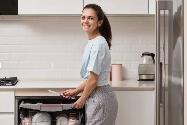 Smiling Woman Unloading Knife Open Automatic Built Dishwasher Machine Clean — Stock Photo, Image