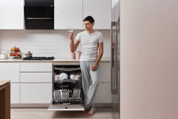Happy Man Taking Out Clean Glass Dishwasher Machine Kitchen Copy — Stock Photo, Image
