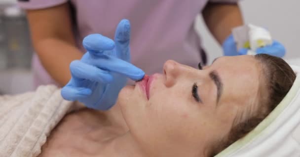 Beautician Applies Lip Balm Female Lips Injecting Hyaluronic Acid Lip — Stock Video