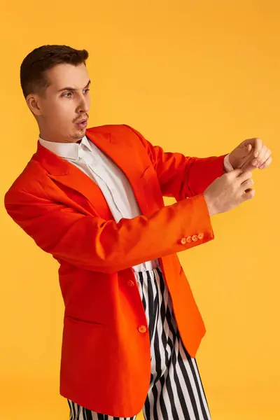 Fashionable Funny Young Man Orange Jacket Striped Pants Yellow Background — Stock Photo, Image