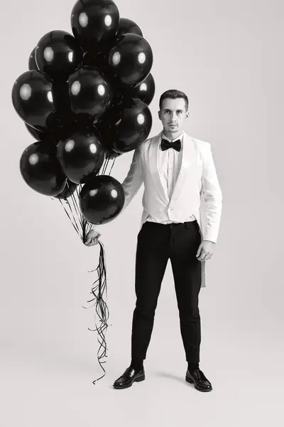 Elegant Businessman White Suit Tuxedo Poses Balloons White Background Birthday — Stock Photo, Image