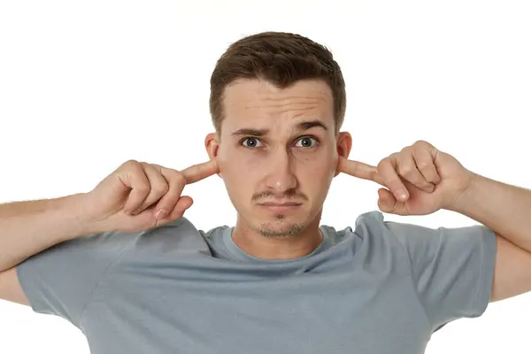 Young Annoyed Caucasian Man Shirt Covers Ears Hands Fingers White Royalty Free Stock Photos