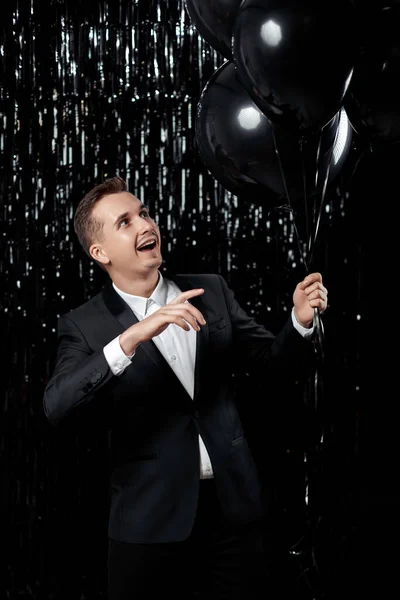 Happy Handsome Guy Black Jacket Holding Black Air Balloons Glitter — Stock Photo, Image