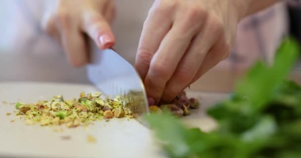 Female Hands Cutting Pistachio Cutting Board Big Kitchen Knife — Stock Video