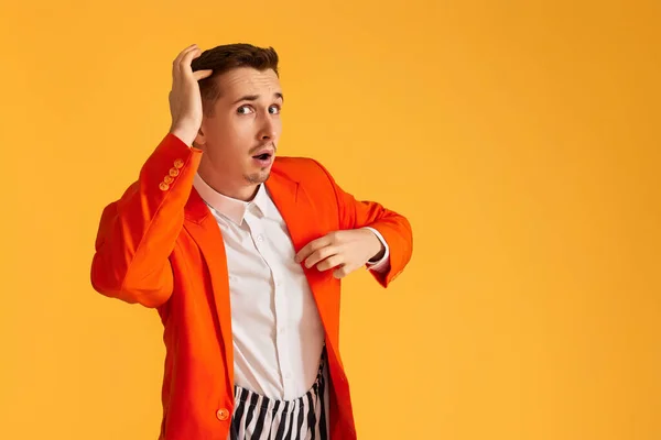 Cheerful Funny Young Man Orange Jacket Striped Pants Yellow Background — Stock Photo, Image