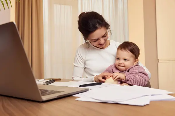 Cheerful Pretty Businesswoman Working Home Her Little Child Girl Royalty Free Stock Images