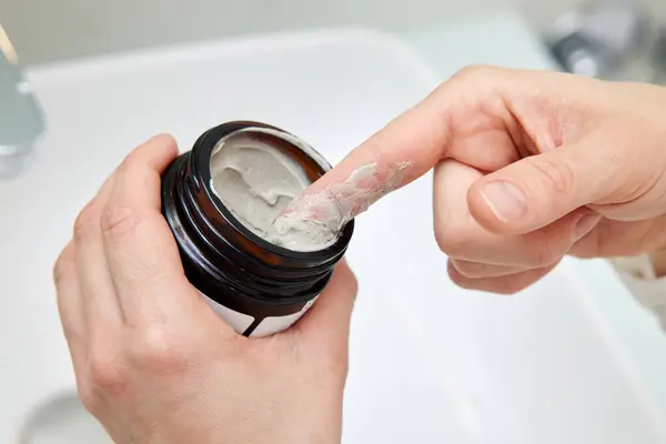 Female Hand Takes Clay Face Mask Jar Home Spa Stock Photo