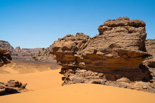 Stock image view in the Sahara desert of Tadrart rouge tassili najer in Djanet City  ,Algeria.colorful orange sand, rocky mountains