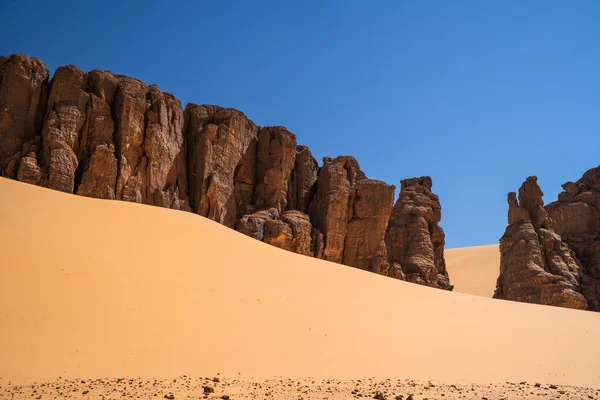 stock image view in the Sahara desert of Tadrart rouge tassili najer in Djanet City  ,Algeria.colorful orange sand, rocky mountains