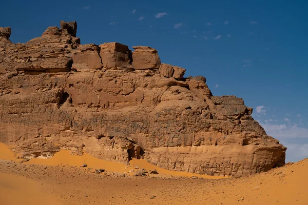 stock image view in the Sahara desert of Tadrart rouge tassili najer in Djanet City  ,Algeria.colorful orange sand, rocky mountains